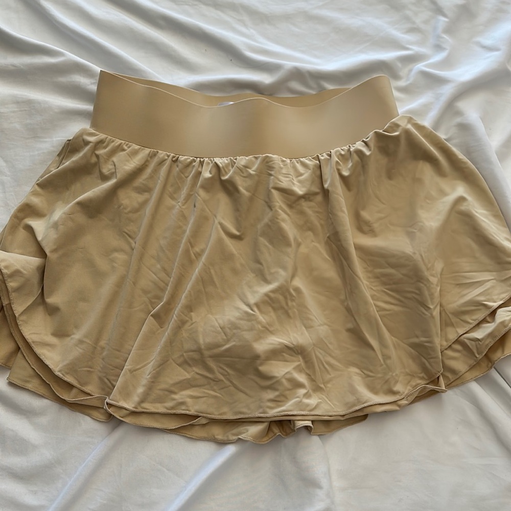 Beige workout skirt with built-in shorts